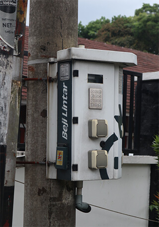 Picture 3: Electricity charging station (ECS) located in Taman Kencana, Bogor, Indonesia. ECS is a stand-alone power systems established to secure electricity services for street vendors across Indonesia.